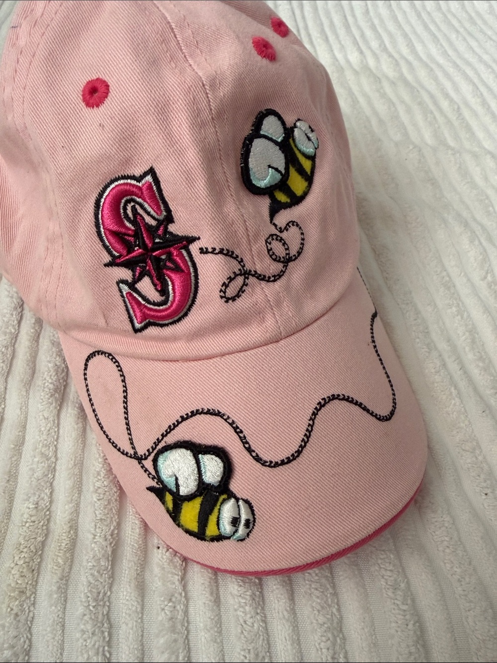 Girls' Pink Embroidered Bee Baseball Cap with Playful Stitching. Child size